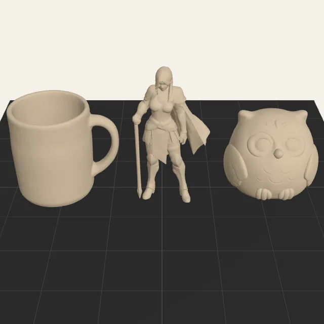 A mug, a knight and an owl set side by side on a 256 mm print bed by the converter